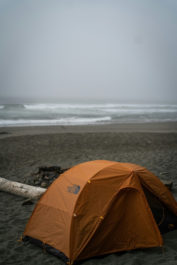 Tent on the beach in poor weather - a small off road caravan would have been better